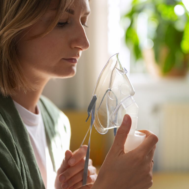 woman taking oxygen therapy in Dubai